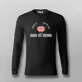 Black long-sleeve shirt with graphic design and text on a gray background