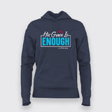Navy women's hoodie featuring 'His Grace Is Enough – 2 Cor 12:9' in turquoise and white typography, enhanced with a red heart at the top.