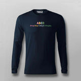 Black long-sleeve shirt with colorful text on a gray background