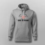 Gray hoodie with text and graphic design on a light gray background