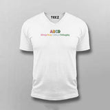 White t-shirt with colorful text on a gray background